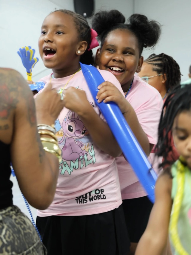 Kids laughing during a children's ministry gathering at The Purpose Place